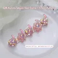Macro view of aurora glitter resin nail art stand set with heart floral base dimensions - Aurora Pink Sequin Nail Tip Holder 02