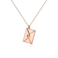 Macro detail of rose gold envelope locket pendant with heart on fine O-chain - Heart Style / Rose Gold