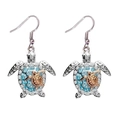 Silver sea turtle earrings with blue rhinestones and a gold baby turtle on a white background - Gold Earrings