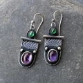 Vintage oxidized silver earrings with purple and green gemstones on a stone background - Style K-Two-tone Gemstone Retro