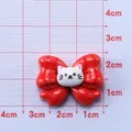 DIY craft resin charm featuring red bow and white kitten head with 3.5cm width dimension - Bow
