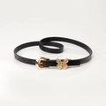 Slim black women belt with golden butterfly buckle detail on a clean white background - Black