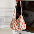 Beige canvas tote bag featuring vibrant orange daisy prints and wide shoulder strap - Red Flowers Green Leaves