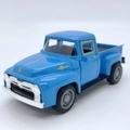Classic blue vintage toy pickup truck model with golden accents on a white background - Blue