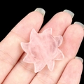 Hand-carved natural rose quartz sun gemstone held by hand for solar system decor - Rose Quartz