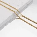 Elegant gold square box chain necklace displayed on stone with a mirrored reflection - 1.5mm Box Chain / 40+5CM Extension Chain / Gold