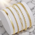Set of five gold Bohemian minimalist bracelets featuring Figaro, snake, and curb chains - Style 8 Gold