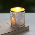 Golden Christmas themed glass candle holder with elk and snowflake silhouettes on a book - Silver Christmas Tree Elk