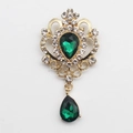 Vintage golden crystal brooch with green teardrop rhinestones and intricate cutouts - Green