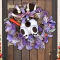 Detail of Easter bunny wreath with carrot and mesh ribbons on dark wood door - Easter Bunny Style 04