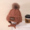 Gorro de punto para niños con orejeras en marrón óxido con pompón y lazo - Niños aprox 3-10 años / Caramelo