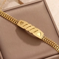 18K gold plated titanium steel chain bracelet featuring a matte heart-shaped cutout plate - Frosted Hollow Heart Style (STB25214-GO)