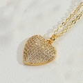 Detailed close-up of a gold heart pendant necklace encrusted with shimmering cubic zirconia - Gold Large Heart