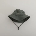 Detail of grey-green kids sun hat with Lucky! smile embroidery and adjustable chin strap - Lucky Smiley / Gray