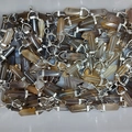 Polished hexagonal natural crystal stone pendants in assorted brown and black agate hues - Grey Agate