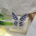 Macro detail of silver ring featuring butterfly wings with blue zircon stones - Silver Color Royal Blue Zirconia