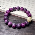Detailed view of purple embossed beads and a white mythical beast carving on the bracelet - Purple Grape Carved Six Characters with Lion Motif