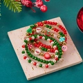Detailed view of five-piece Christmas beaded bracelet set with festive holiday charms - Multi-color - 5Pcs Set