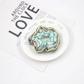 Detailed shot of a colorful striped fabric hair scrunchie placed on a white ceramic plate - Multi-color Striped