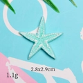 Detail of blue resin starfish charm with embossed texture, size 2.8x2.9cm and 1.1g weight - Blue Thin Starfish
