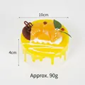 Realistic 10cm mango mousse cake PU squishy toy with mango slices and chocolate topping - Yellow