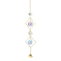 Macro detail of golden metal suncatcher with star crystal prisms and bell pendant charm - Model SY-06
