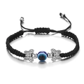 Handmade black cord Evil Eye bracelet with silver butterfly charms and blue resin bead - Butterfly / Black