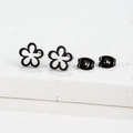 Macro shot of minimalist black hollow flower earrings on white stone surface - Five-Petal Flower / Black