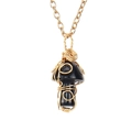 Macro shot of handmade gold wire wrapped mushroom pendant with polished black onyx stone - Obsidian