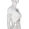 Detail of white ribbed knit crop top with a V-neck and stylish front twist design - S / White