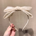 Elegant beige satin double bow headband with a smooth silk-like texture and soft finish - Champagne
