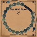 Detail of dark green natural stone beads and sunflower charm on a gift display card - Sunflower Pendant (WB1017) / Southern Jade Bracelet