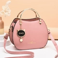 Pink cat-themed crossbody bag with gold ring handle and cute kitten charm for girls - Pink