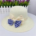 Detail of straw sun hat featuring a blue plaid and beige layered ribbon bow accent - M (With Windproof Rope) / Milk White