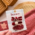 Close-up of a handmade 3-piece red fabric bow hair clip set for girls on a display card - Red Ball & Knit Bow Set 3Pcs
