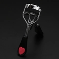 Silver metal eyelash curler with black handles and red heart detail for natural curls - Chrome Curler with Heart and Comb Black Duckbill Handle Black Rubber Pad