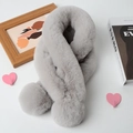 Detail of grey plush faux rabbit fur scarf with decorative pom-poms on white background - Light Gray