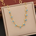 Collana in acciaio inossidabile dorato con perline blu evil eye in scatola regalo - Collana