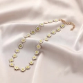 Golden daisy chain necklace with white floral pendants on elegant champagne silk fabric - White Daisy Clavicle Necklace
