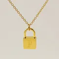Minimalist gold-plated padlock necklace featuring an engraved vintage letter P pendant - Letter P Style