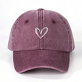 Detailed view of white heart embroidery on washed vintage purple cotton baseball cap - One Size / Burgundy