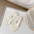 Beige cotton crew socks featuring heart embroidery and she is kind text with frill cuffs - White
