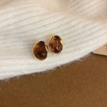 Macro shot of 14k gold plated amber resin earrings on a white knitted sweater texture - Silver Earring Post - Coffee
