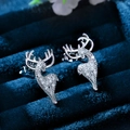 Sparkling silver elk stud earrings with pavé zircons on a dark blue velvet gift box - White Gold