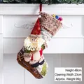 Large 48cm Christmas stocking featuring a 3D Santa Claus with gold sequins on white fireplace - Skiing Santa Christmas Stocking