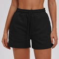 Women's black athletic shorts featuring high elastic waist with drawstring and side pockets - Premium Black