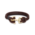 Detail of a brown woven rope bracelet featuring a polished gold anchor metal buckle - 23cm / Gold Coffee