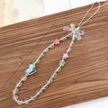 Phone charm with colorful star and heart beads featuring an iridescent ribbon bow - AB Bow (K1056)