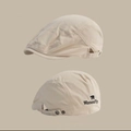 Close-up of beige cotton canvas newsboy cap with metal buckle and bear embroidery - Beige Polar Bear