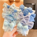 Handheld set of girls' blue bow hair elastics and clips in various fabrics and textures - Blue Floral Style (0662-12)